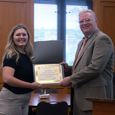 Lauren Berry receives the Violet Braly Award, presented by Dean of Students Jim Wiltgen.