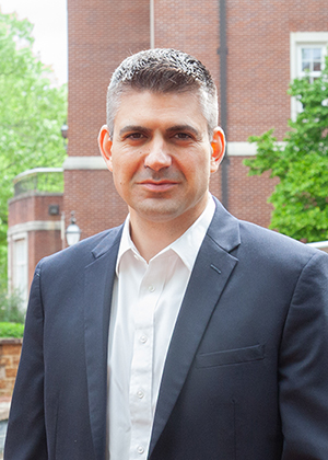 Man wearing dress shirt and suit jacket